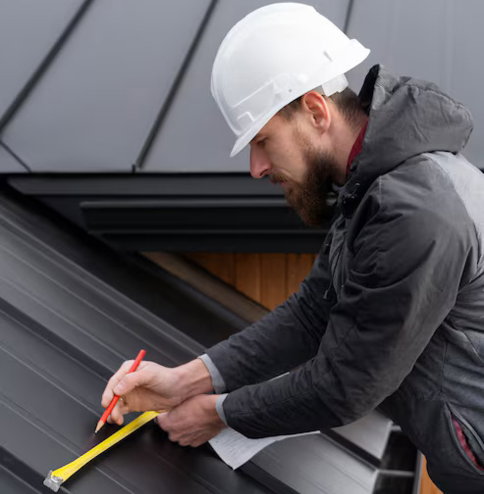 roof-inspect.jpg Roofer taking measurements on sloped shingle roof