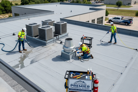 Firefly-this-is-supposed-to-be-a-wall-at-the-side-of-the-building-.png Aerial view commercial flat roof installation | San Marcos roofing project